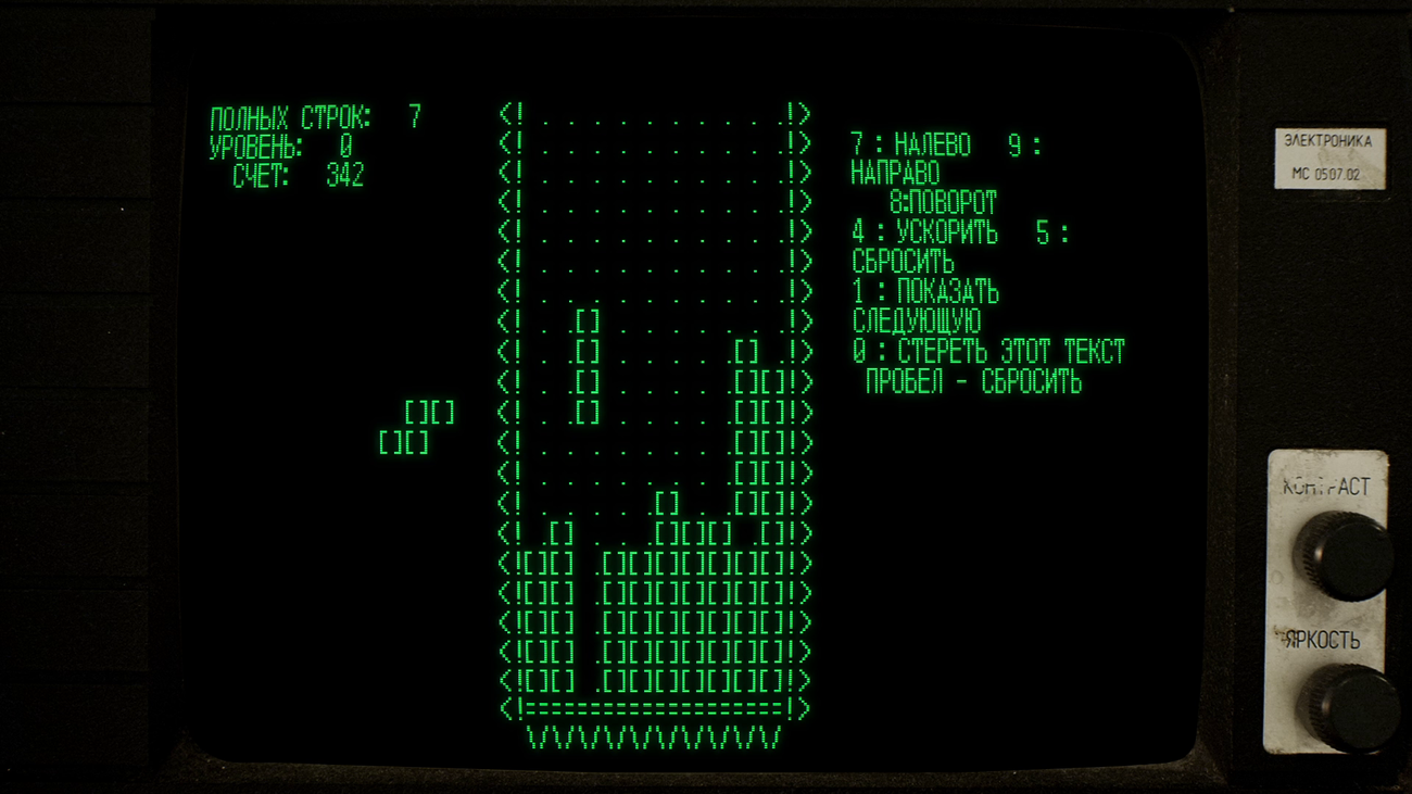 A green computer screen shows the basic first playable version of Tetris on the Russian Electronika 60 computer in Tetris Forever
