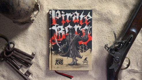 The cover of pirate borg on a sandy background next to a flintlock pistol and keys
