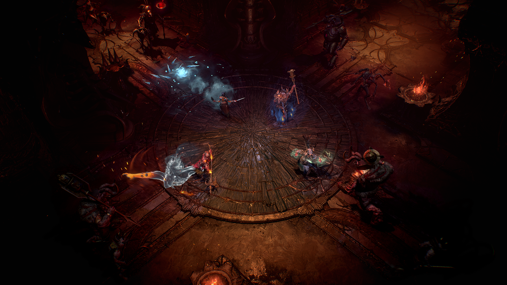 The character selection screen in Diablo 4, featuring the default designs for each character around a fire. From left to right, there’s the Barbarian, Necromancer, Sorcerer, Rogue, and Druid.