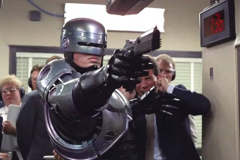 robocop holding a gun