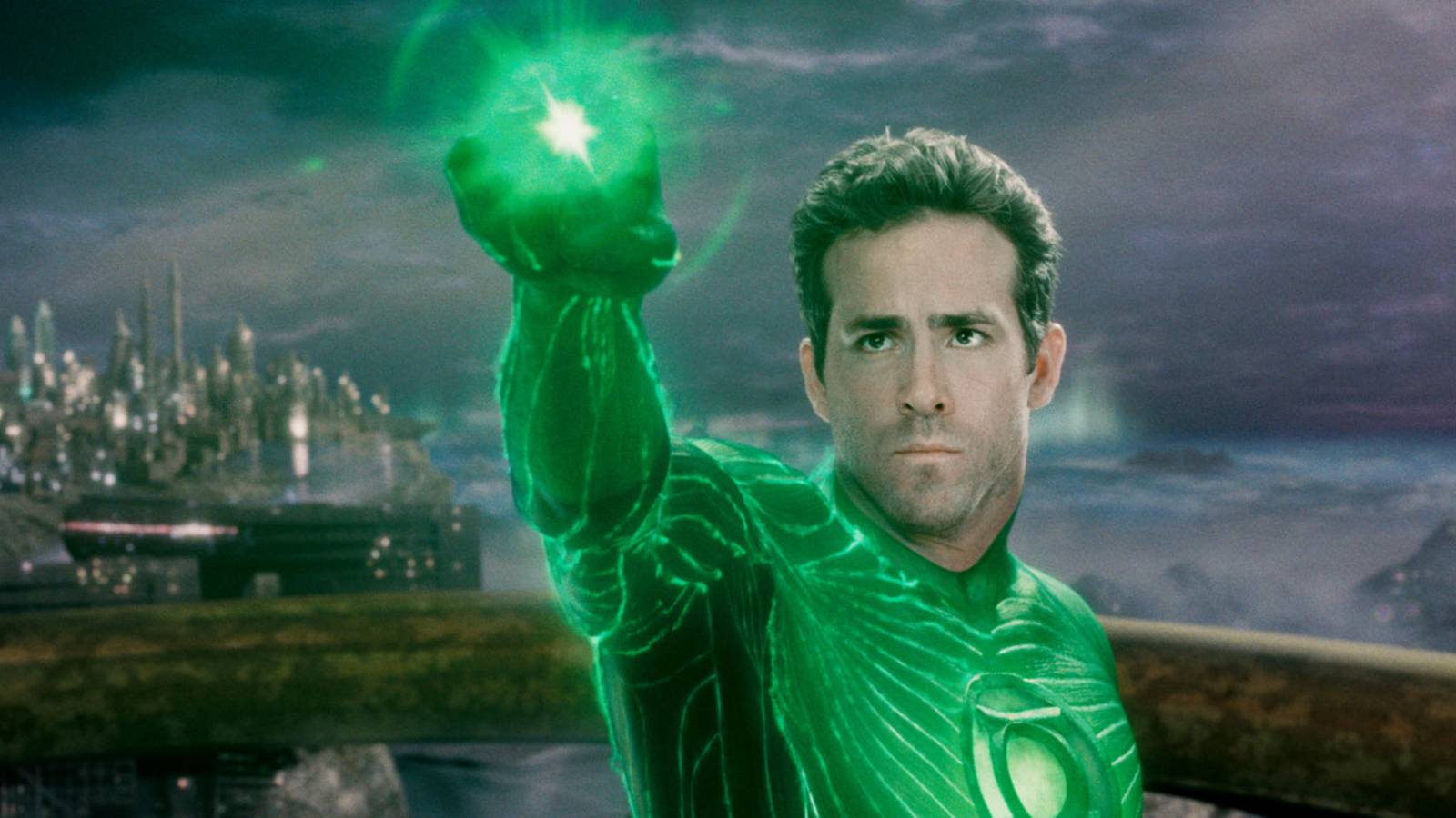 Ryan Reynolds, as the Green Lantern, holding up his green ring on an alien planet