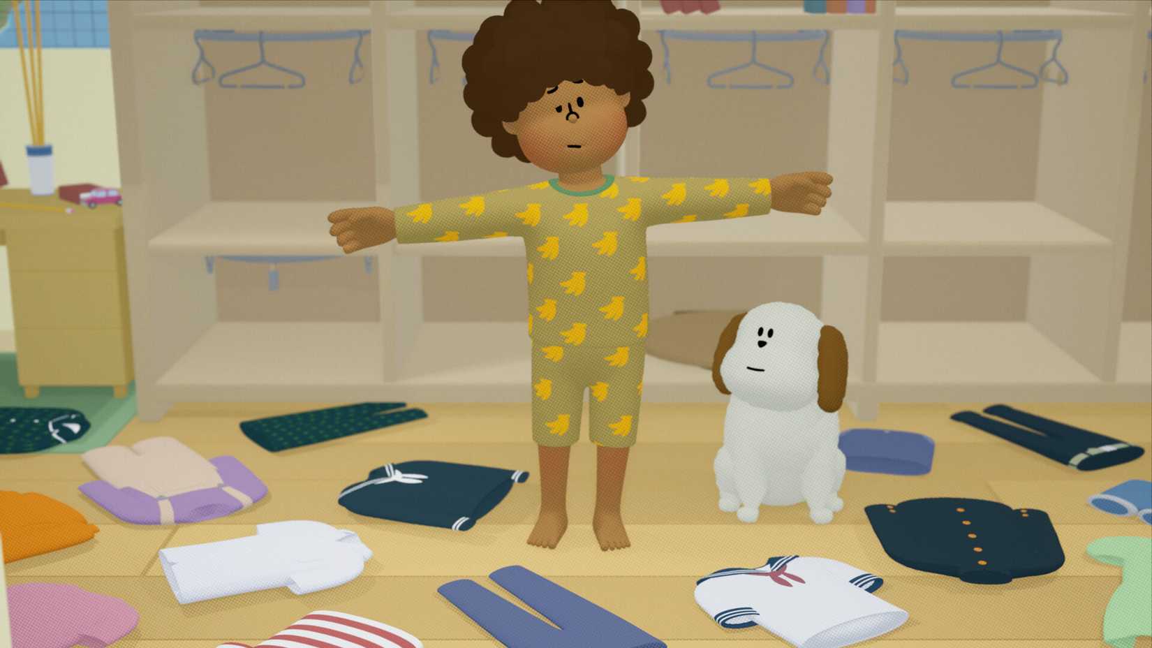 A child with their arms stuck in a T position stands beside a dog, surrounded by clothing on the floor. They’re wearing banana pajamas.