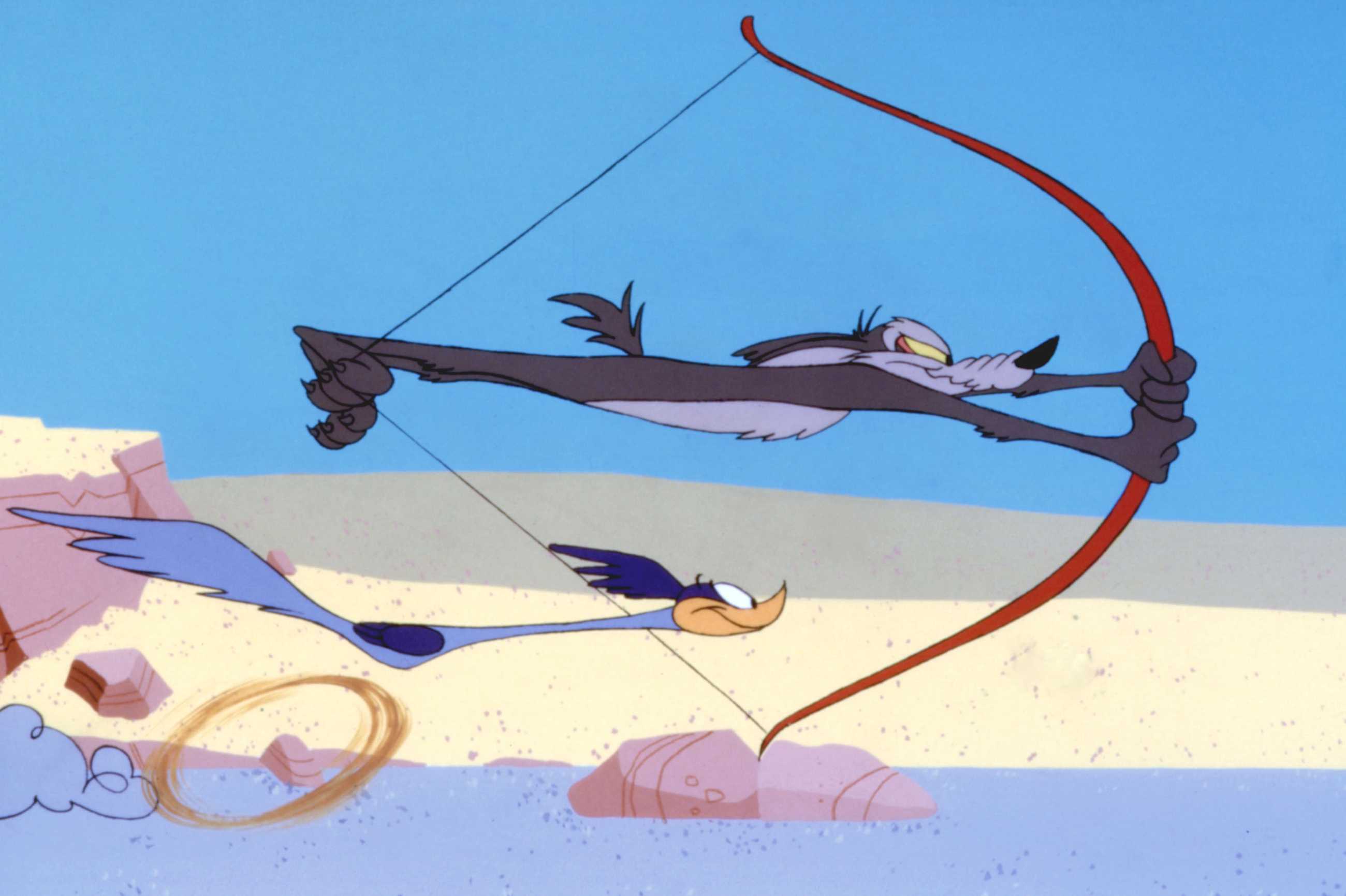 Wile E. Coyote and the Road Runner in the 1994 animated short “Chariots of Fur.” As the Road Runner zips by, the Coyote prepares to fire himself like an arrow from an actual, enormous bow.