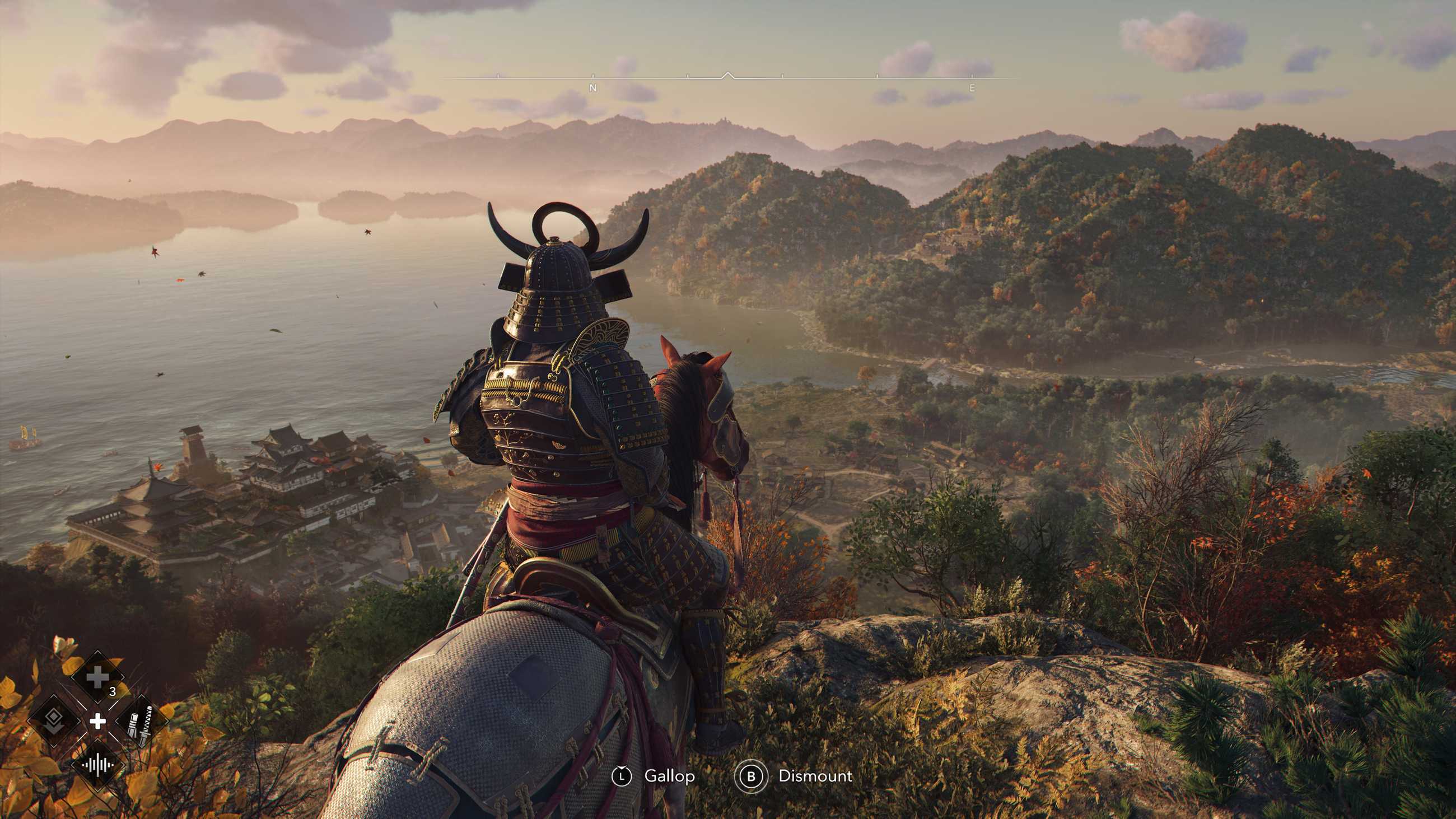 Yasuke, on horseback, surveys a coastal vista at golden hour in autumn in Assassin’s Creed Shadows