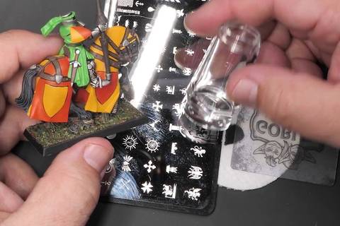 Hate putting decals on your painted miniatures? Try stampin’ instead.