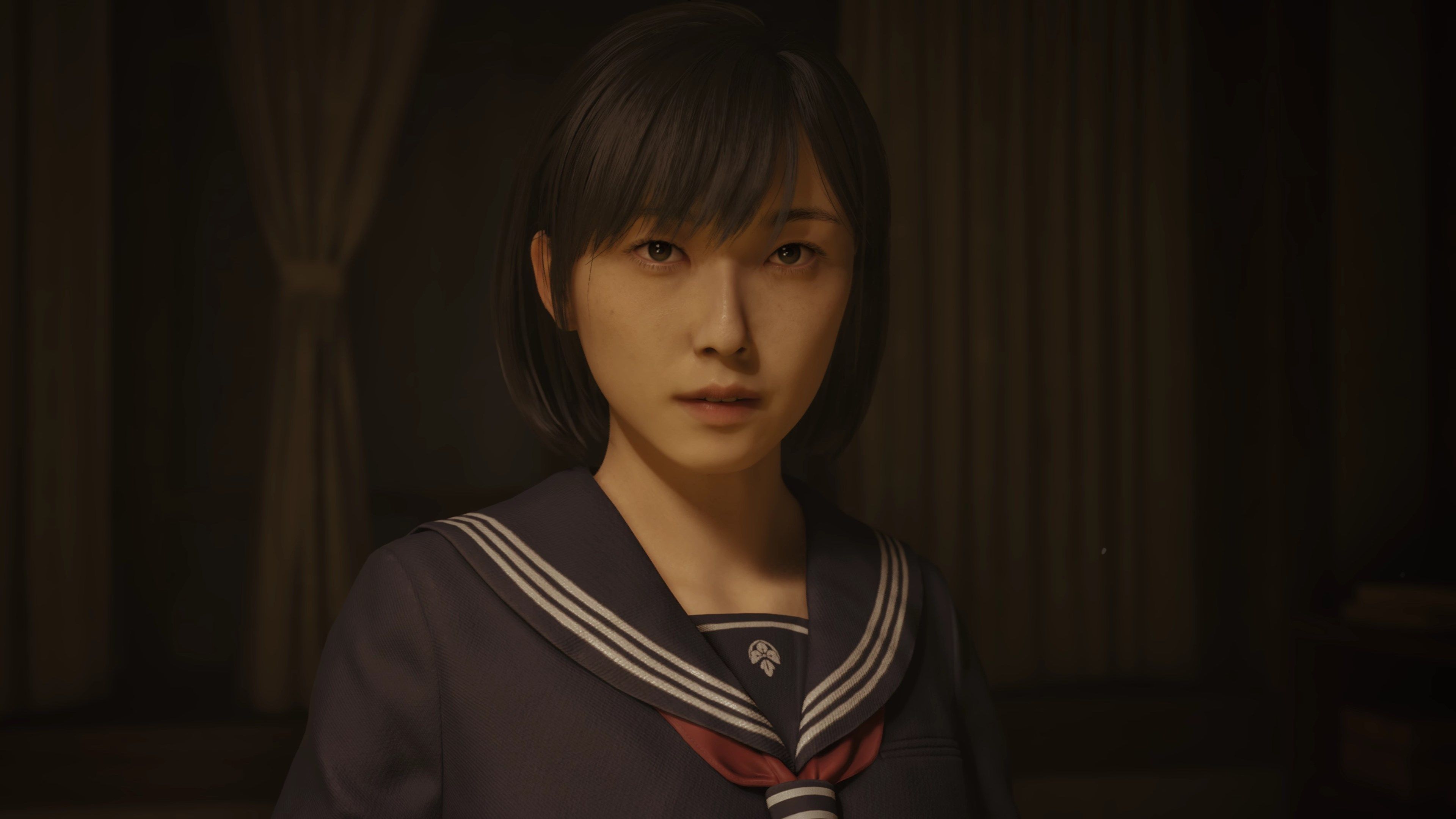 A screenshot from Silent Hill f showing a close-up on the face of its schoolgirl protagonist. She looks worried