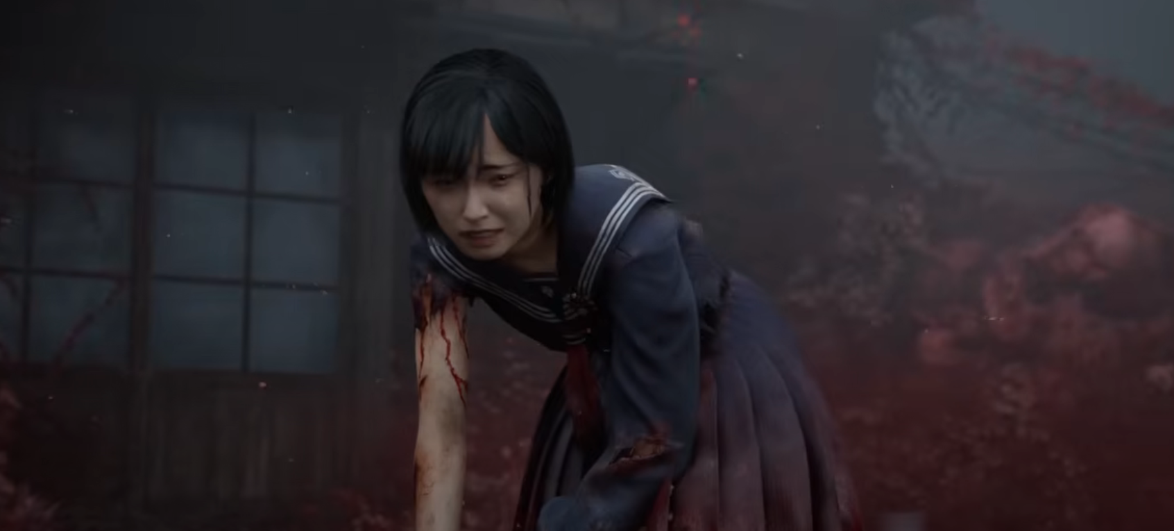 Hinako from Silent Hill f standing up after being wounded and getting ready to fight