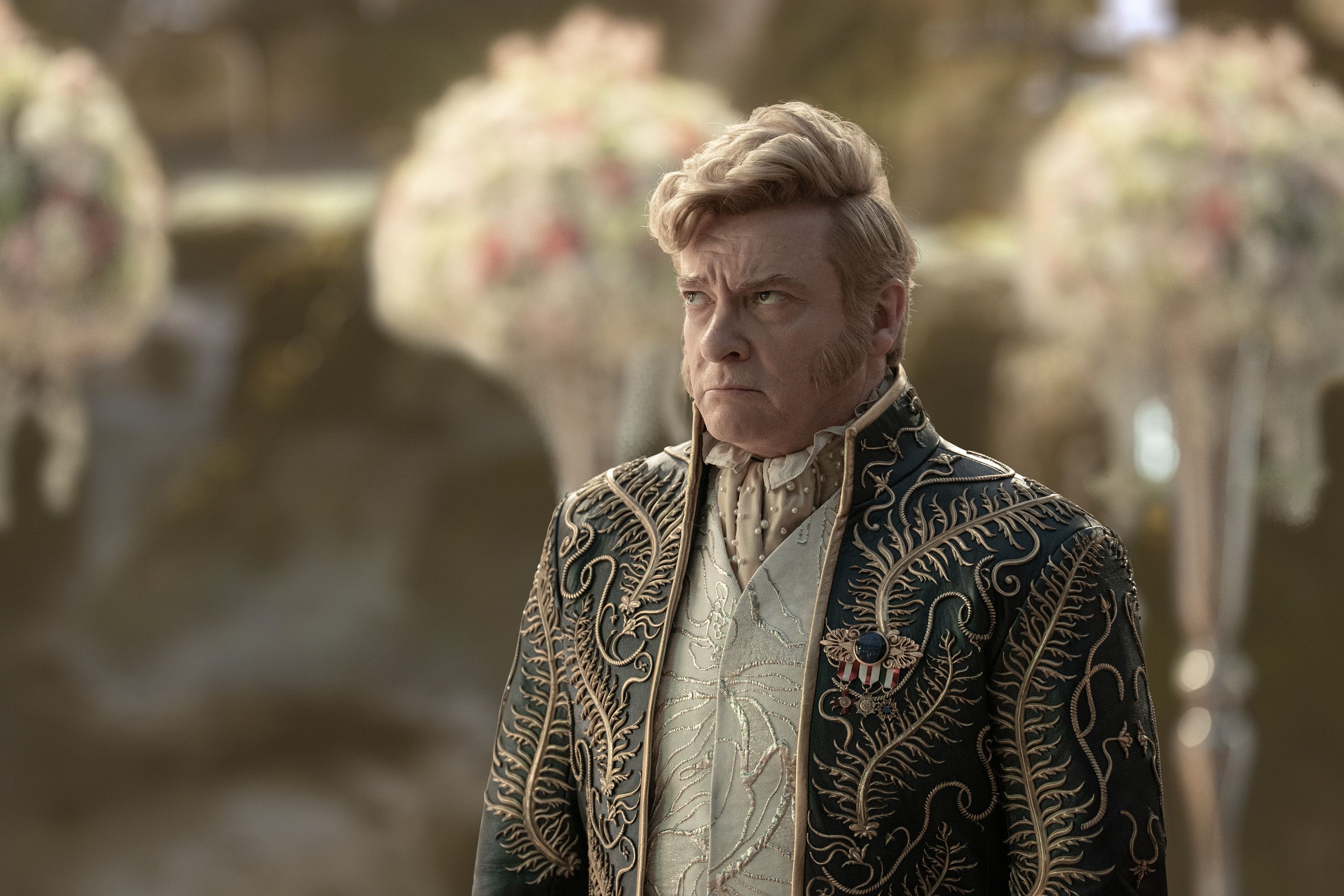 Rhys Darby wears a stylish blue coat as Trelane in Star Trek: Strange New Worlds