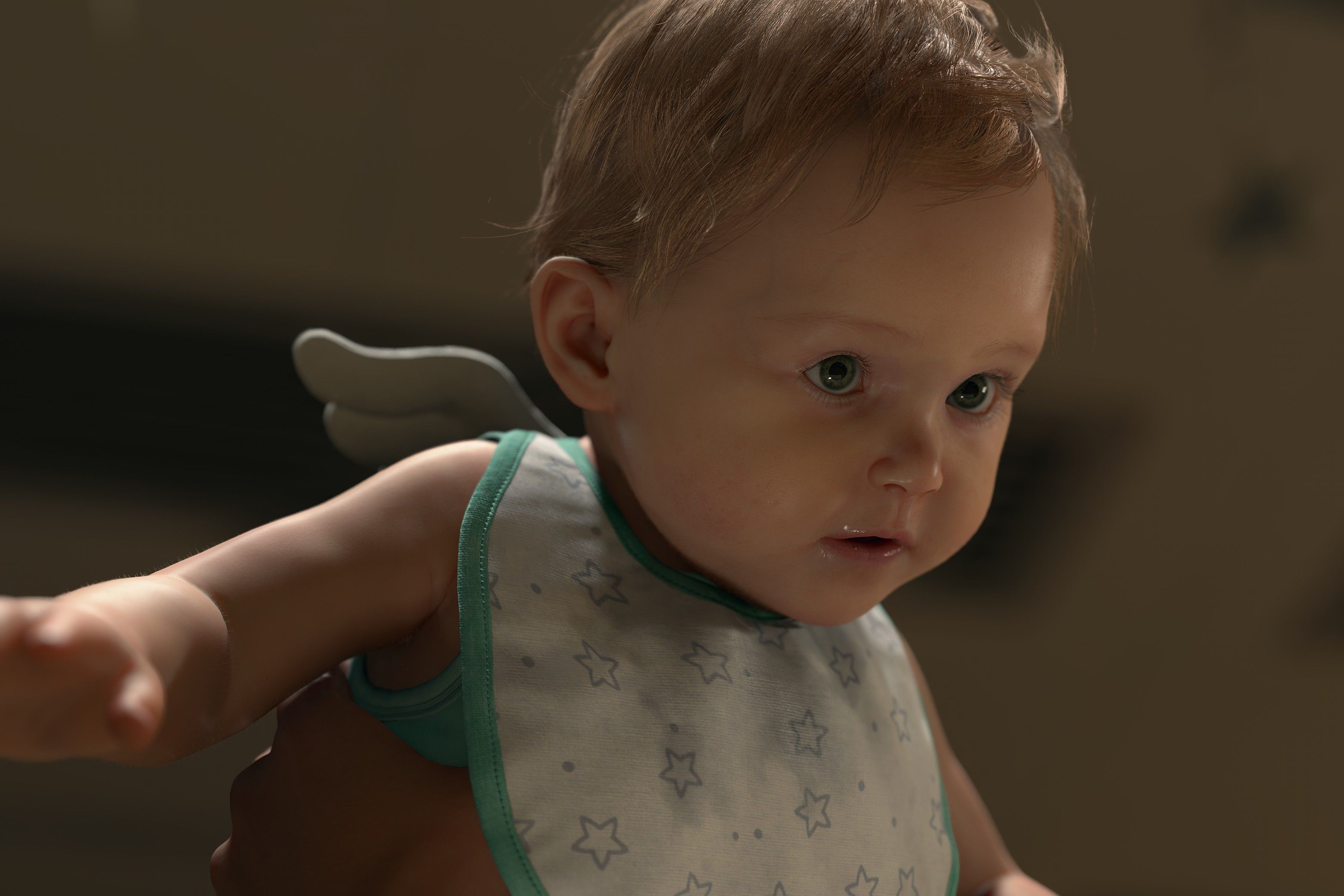 A cute baby waring little angel wings and a bib in Death Stranding 2