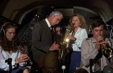 In a scene from the seminal spoof movie Airplane! (1980), a flight crew uses their instruments, but musical ones, one of the movie's dozens of silly puns