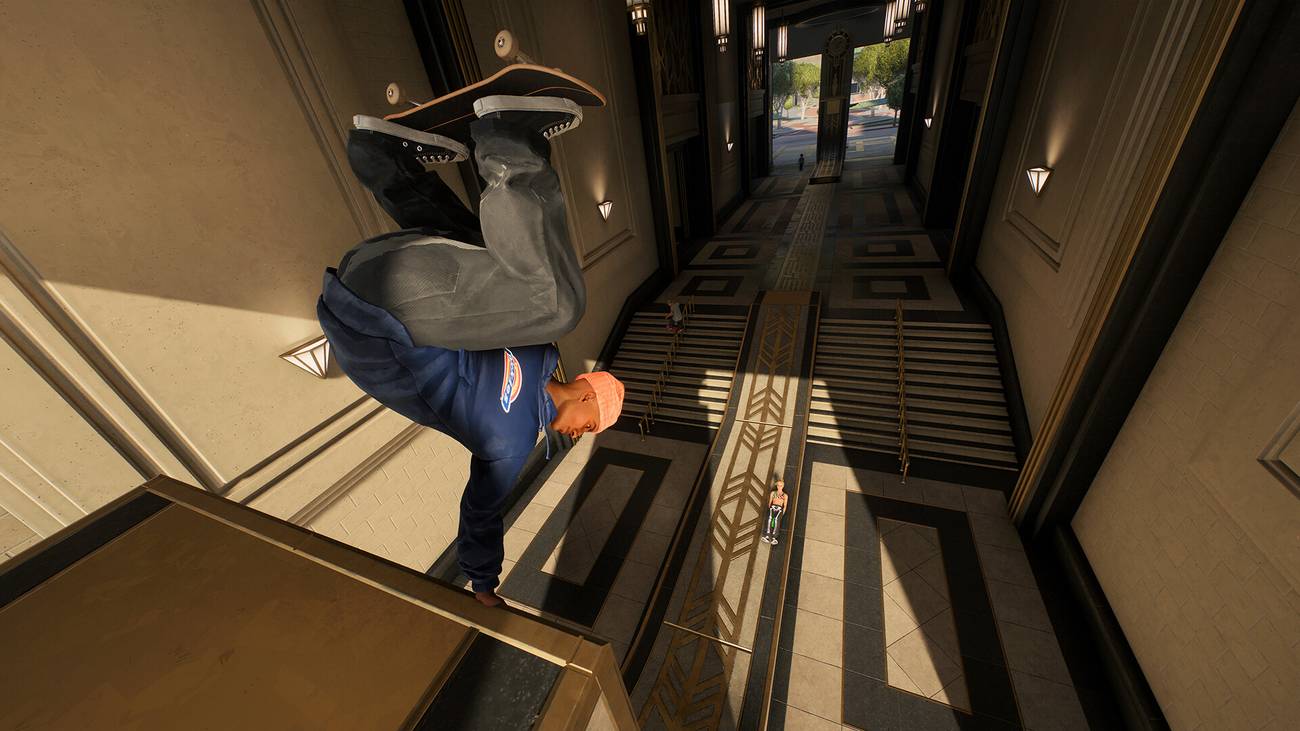 A skater performs a handstand on a ramp in Skate.