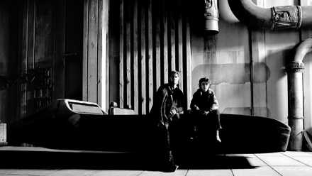 Ryan Gosling and Flynn Gray sit on a landspeeder in a set photo from Star Wars: Starfighter