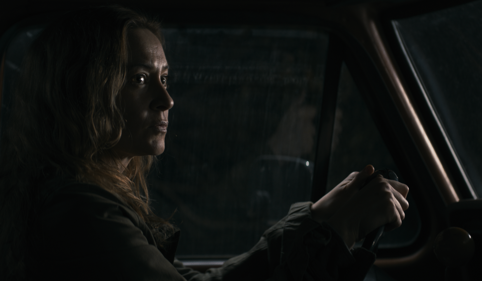 Mia driving a car in Shelby oaks