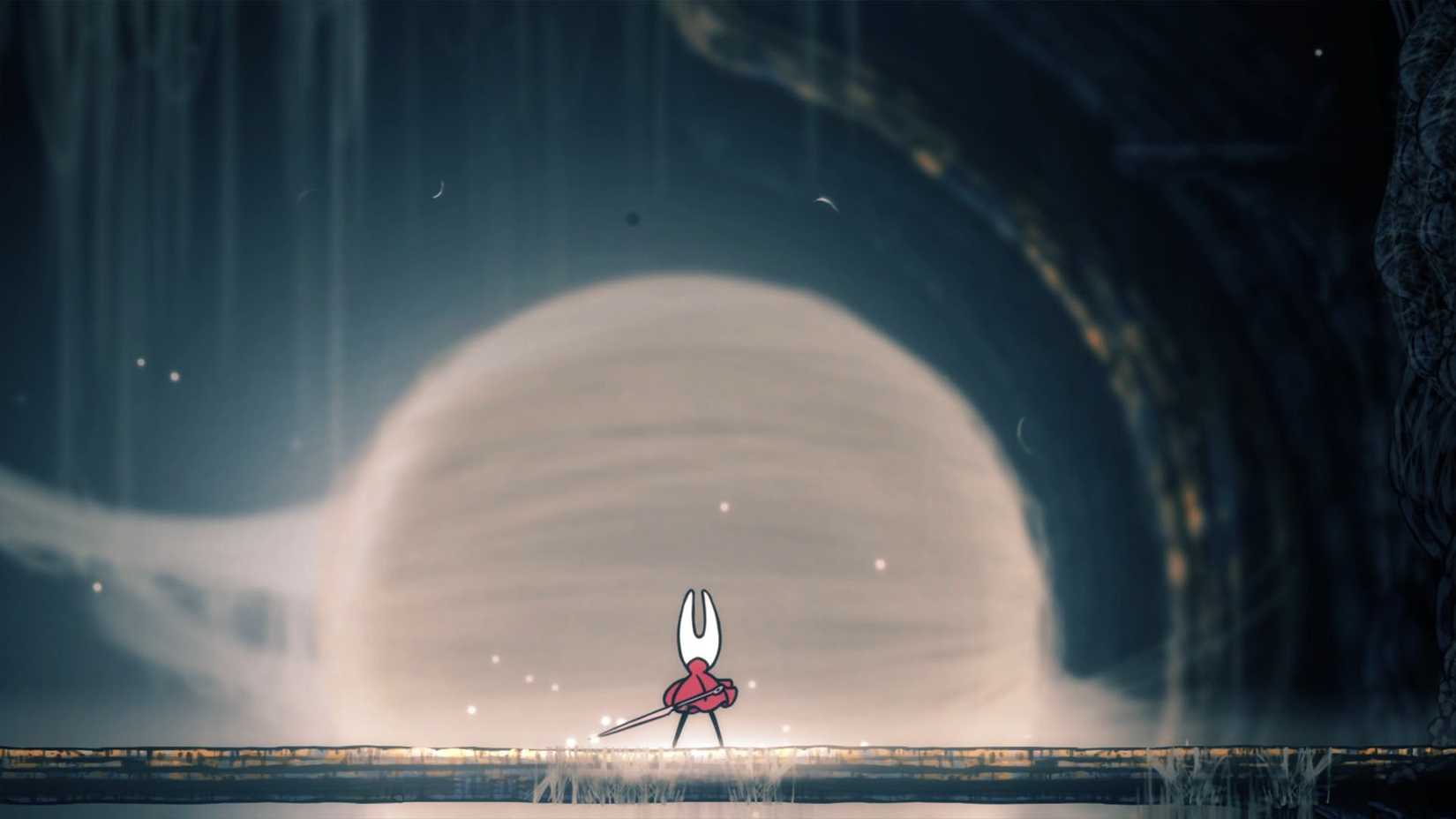 Hornet standing in front of a giant silk cocoon in Silksong.