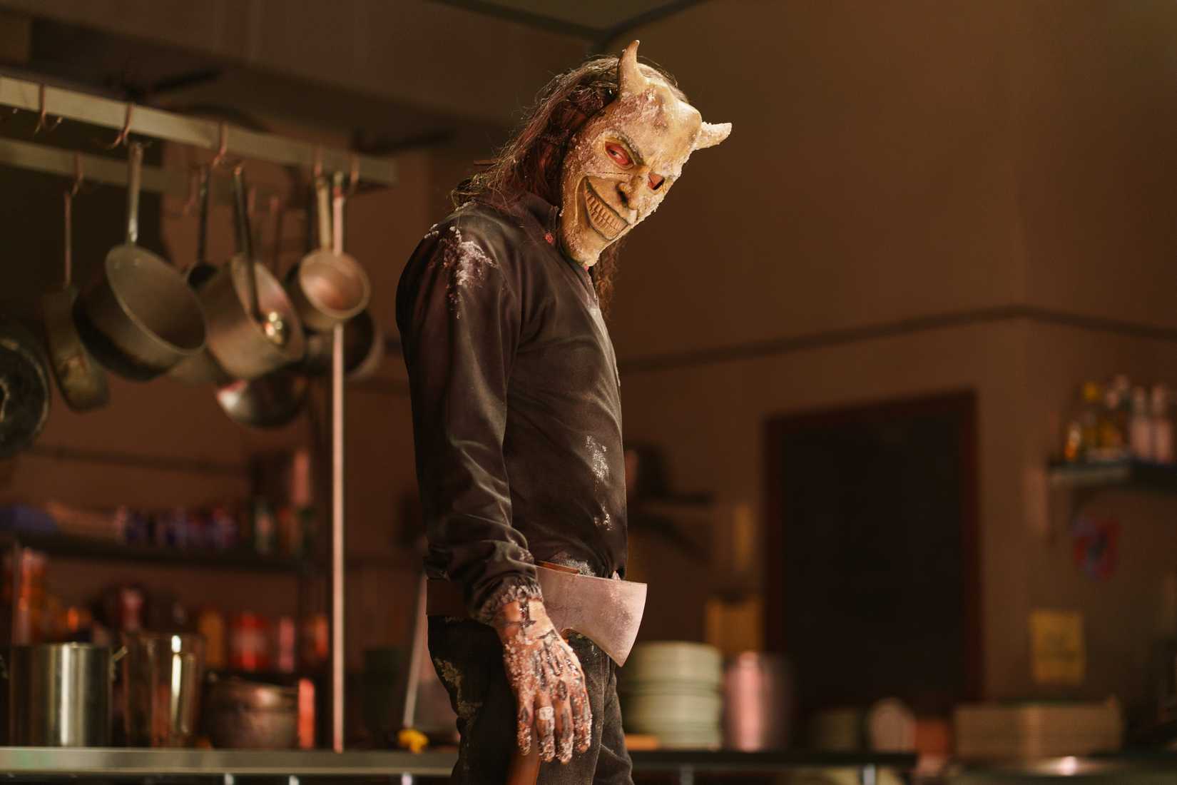 The Grabber standing with an ax in Black Phone 2