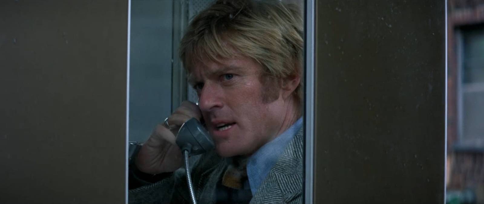 Robert Redford makes a tense phone call from a booth in Three Days of the Condor