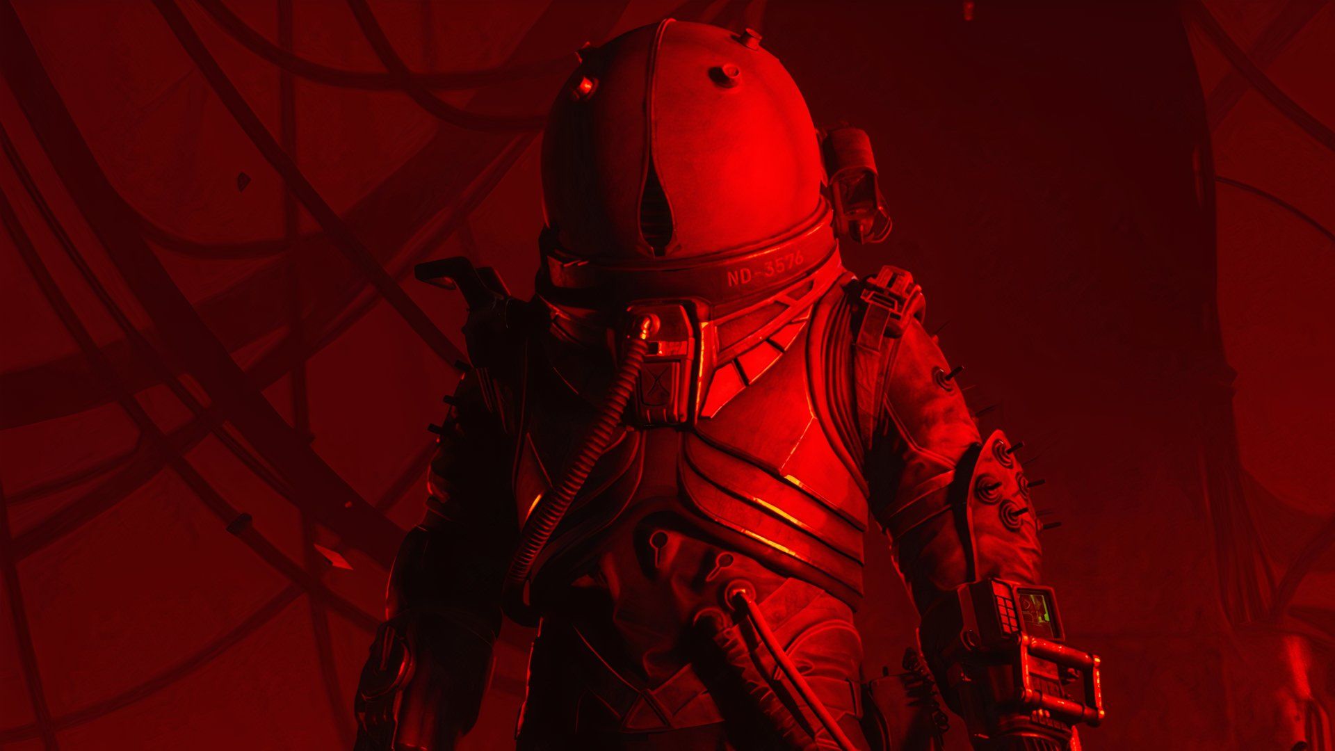 The Traveler faces the camera, bathed in red light.