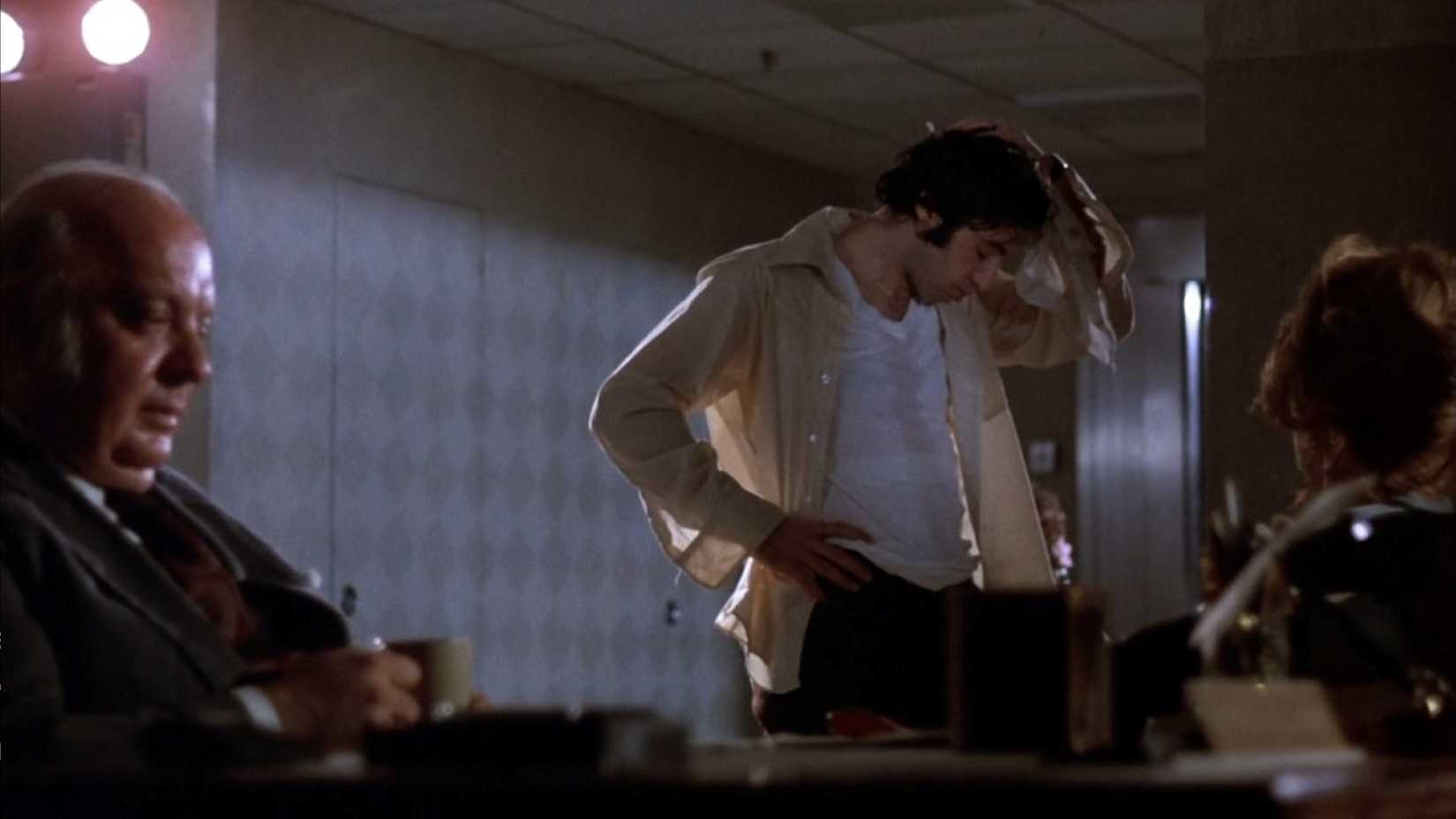 In a scene from late in the film Dog Day Afternoon, a sweaty Sonny (Al Pacino) weighs his options