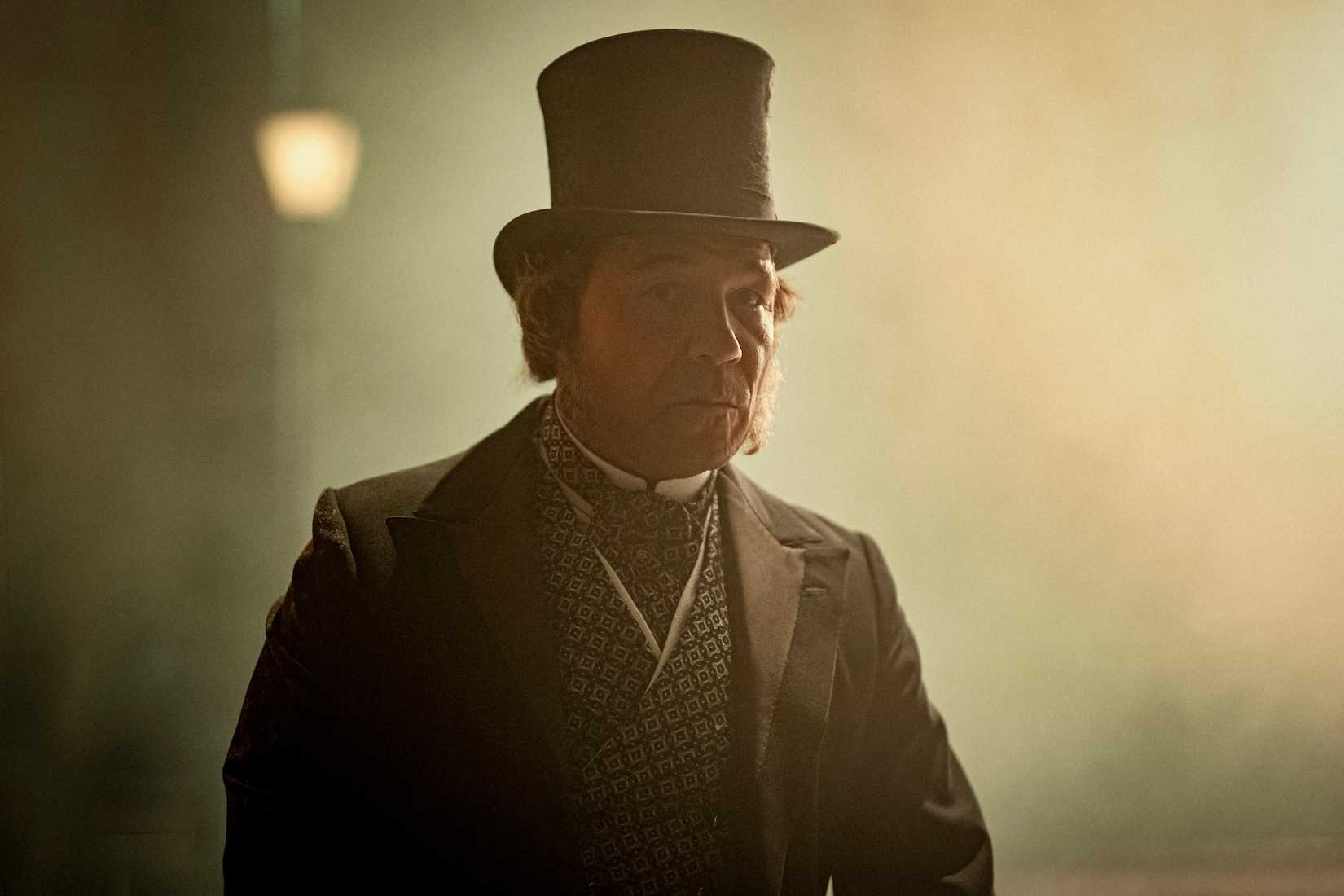 Stephen Graham in a fancy victorian era hat in Bodies