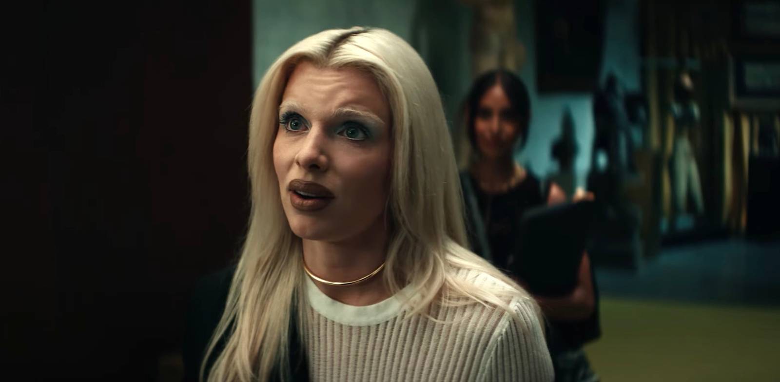 Julia Fox as Elsie in Him, bleached blonde hair and bold contour makeup