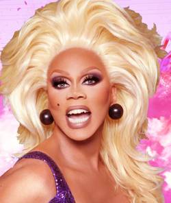 RuPaul in a blonde wig with a blown up railway train behind her. Image from Polygon and World of Wonder; Netflix