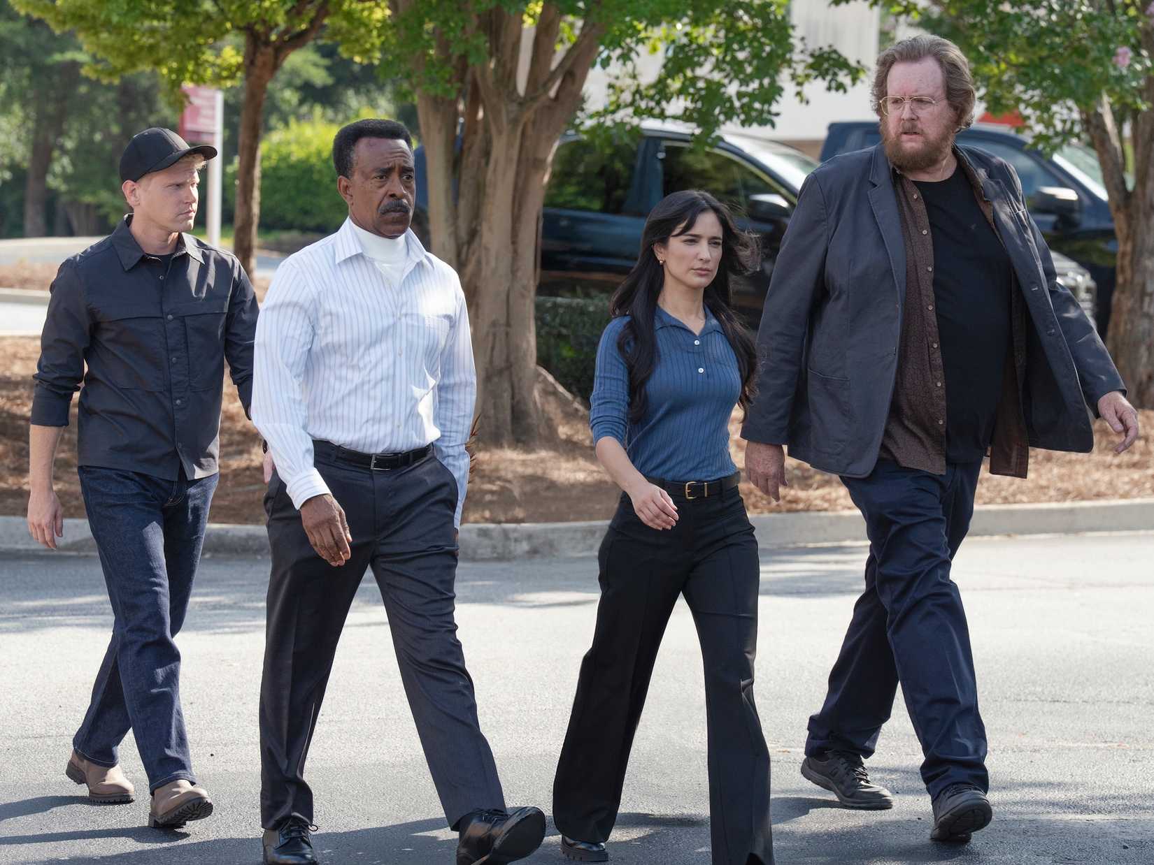 (From L to R) Tim Meadows, Sol Rodriguez, and Steve Agee walking down a parking lot in Peacemaker