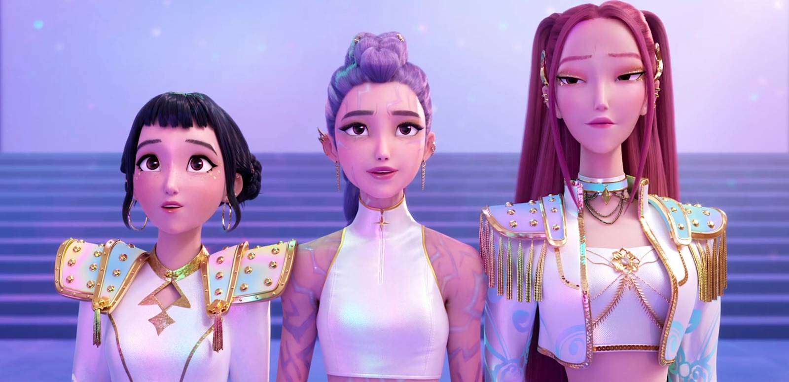 HUNTR/X from KPop Demon Hunters onstage in white and gold costumes