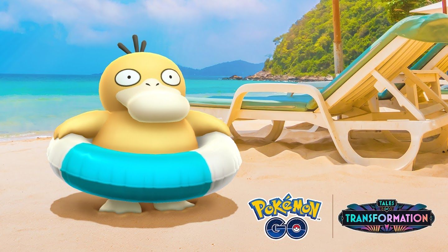 A Psyduck with a pool floaty around its waist sits on the beach in Pokémon Go.