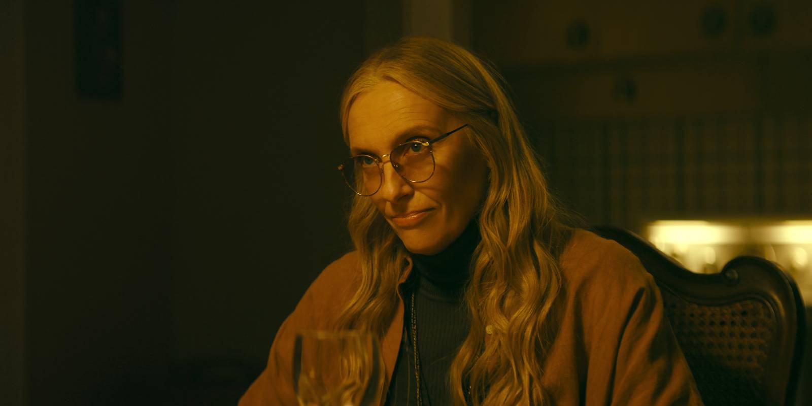 Toni Collette in Wayward wearing glasses and a brown coat
