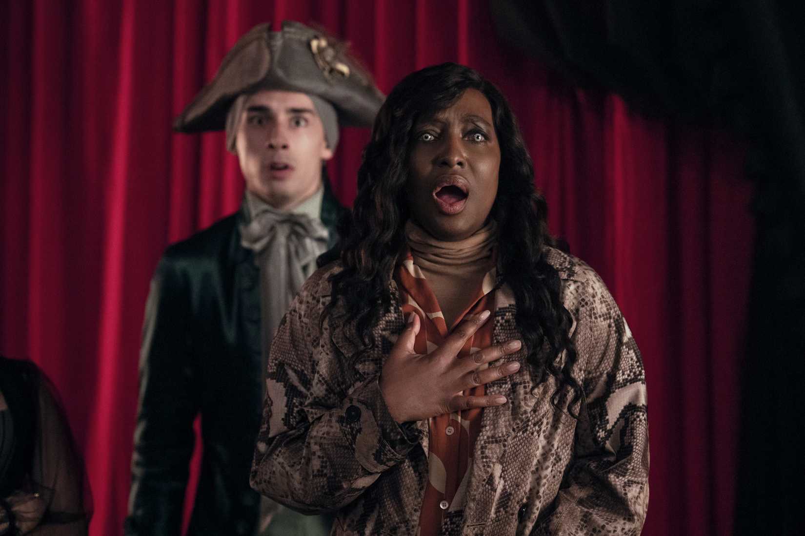 Image featuring Gabrielle Barclay from Wednesday. She has her mouth open, looking afraid.