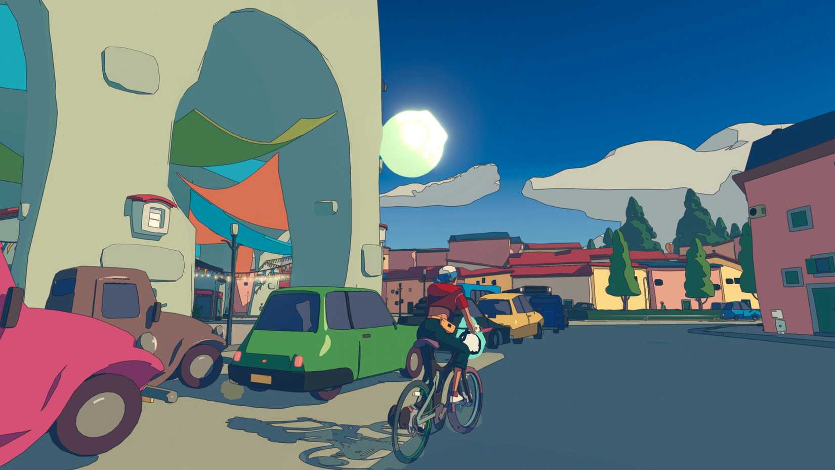 A bike rider bikes through a town in Wheel World