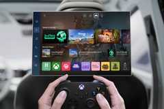 A first-person view of a person playing with an Xbox controller in a vehicle