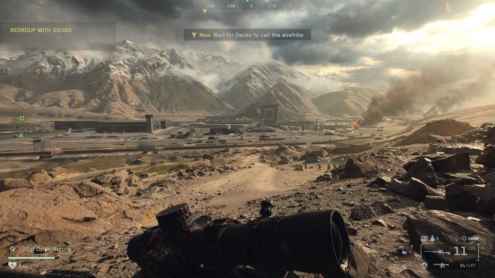 The player wielding a sniper rifle in the Battlefield 6 campaign, looking across an airfield amidst the mountains.