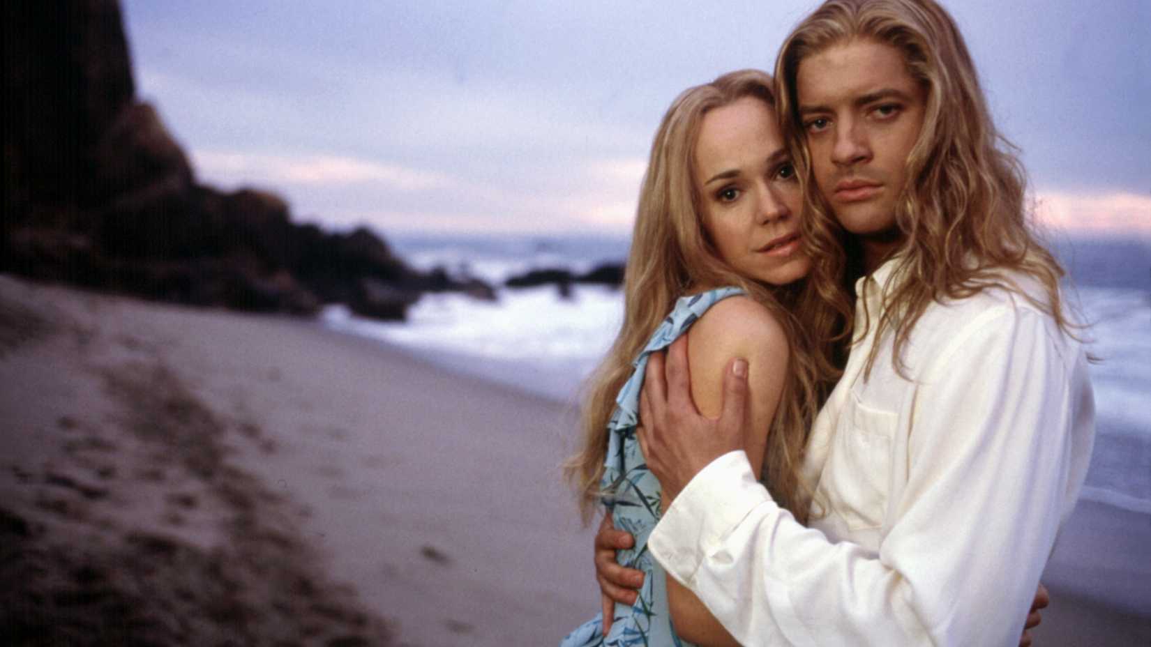 Frances O'Connor and Brendan Frasier huged up together on a beach from BeDazzled