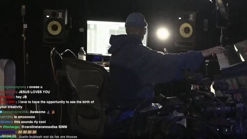 Justin Bieber faces away from the camera while livestreaming on Twitch as he puts together a beat for an unreleased song. 