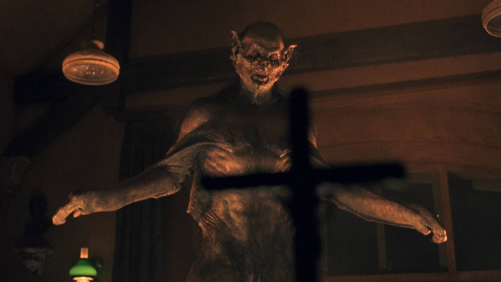 A bat-human hybrid version of Dracula is repelled with a crucifix.
