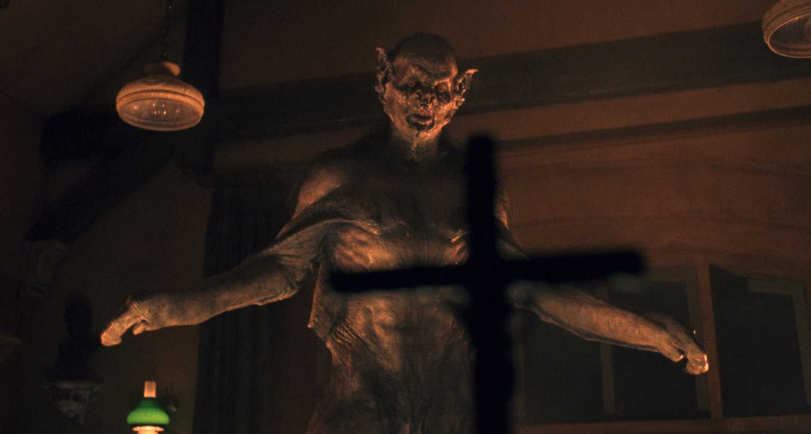 A bat-human hybrid version of Dracula is repelled with a crucifix.