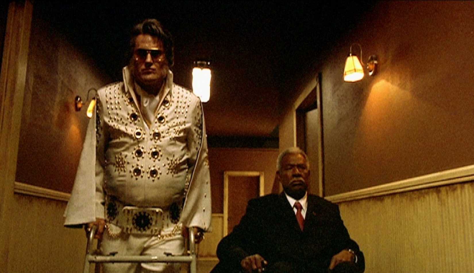 Bruce Campbell and Ossie Davis walking through a nursing home hallway in Bubba Ho-Tep