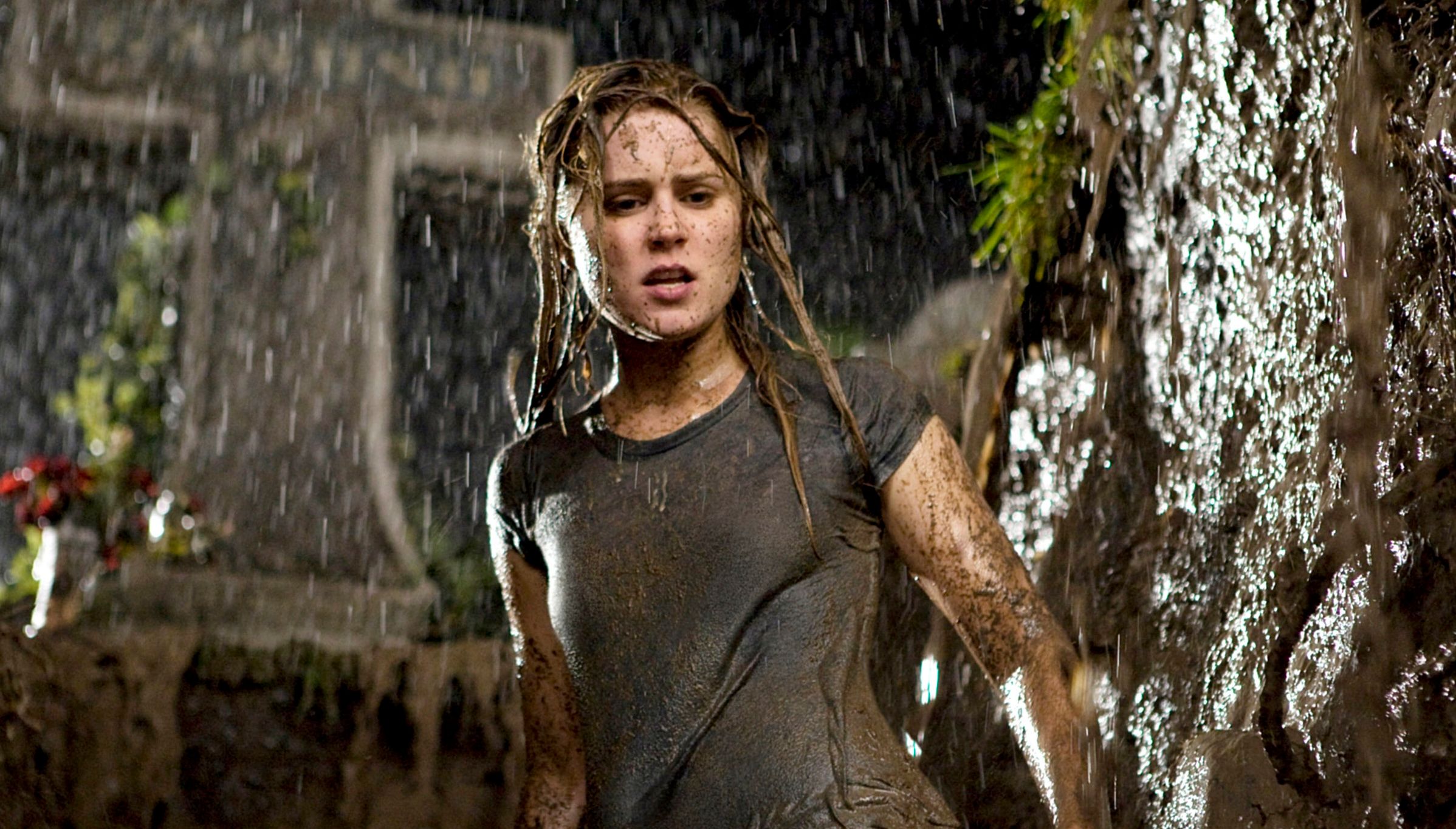 Alison Lohman standing in a grave while it rains in Drag Me to Hell