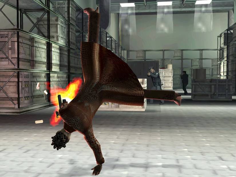 A character shoots a gun while cartwheeling in Enter the Matrix.