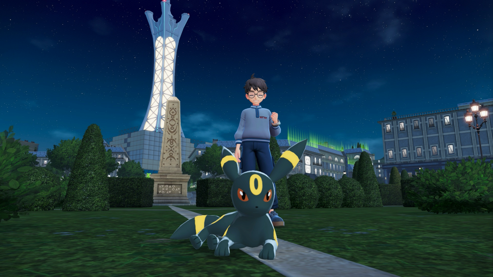 A Pokémon Trainer poses behind Umbreon in Pokémon Legends: ZA.