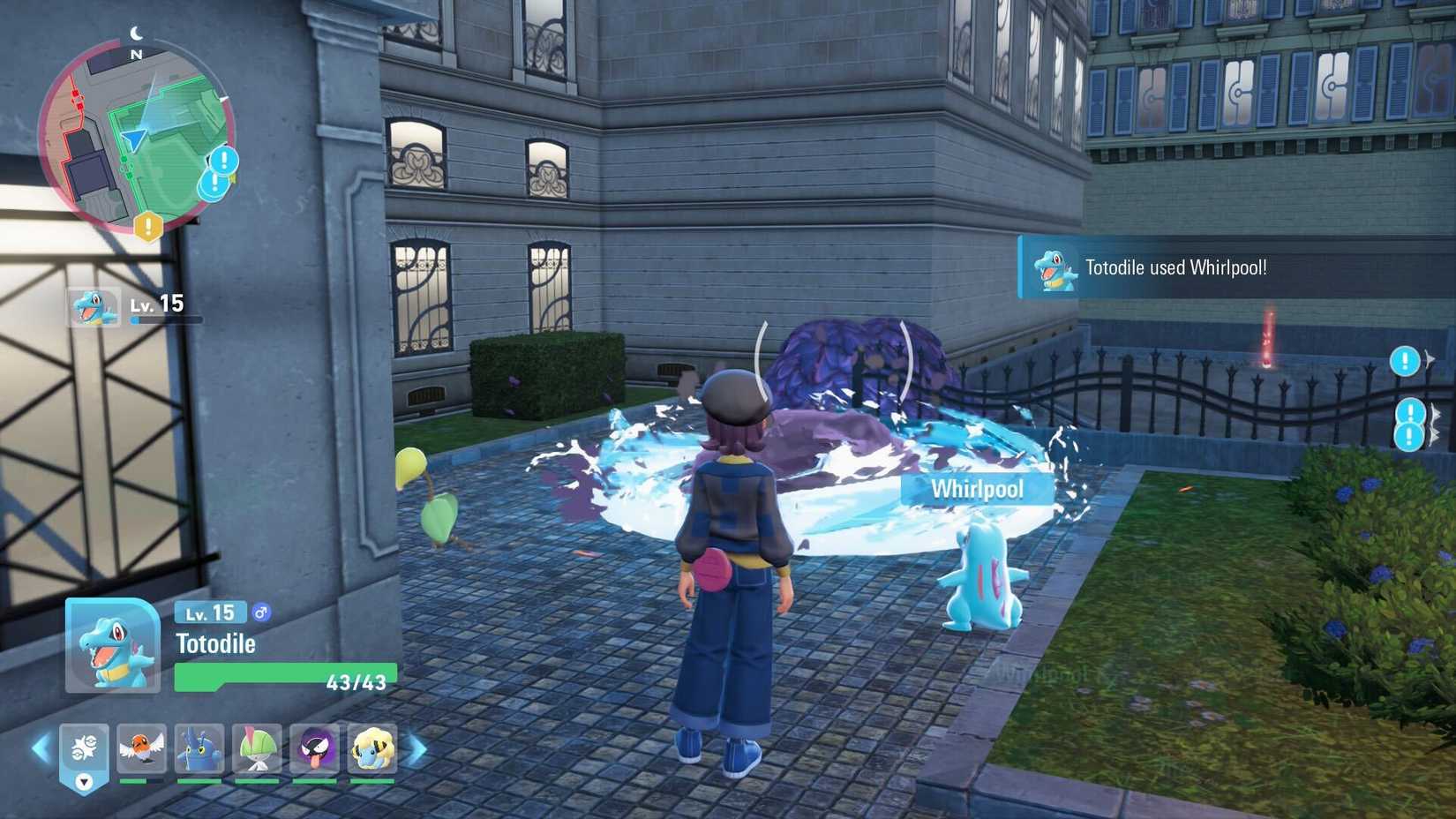 A Totodile clears away a pile of purple sludge in Pokémon Legends: Z-A.