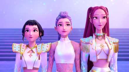 A screenshot from Netflix's KPop Demon Hunters. It shows Zoey, Rumi and Mira standing together, dressed in white.