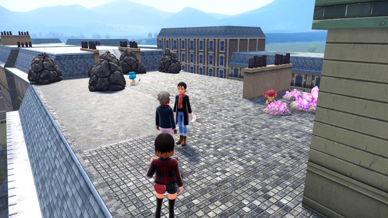 A trainer approaches a Panpour and Pansear on a roof top in Pokémon Legends: Z-A