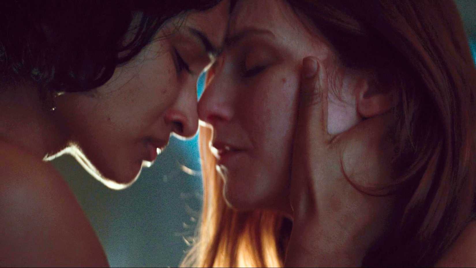 A screenshot from Andor season 2 featuring Cinta Kaz (Varada Sethu) and Vel Sartha (Faye Marsay), their heads pressed together in an embrace.