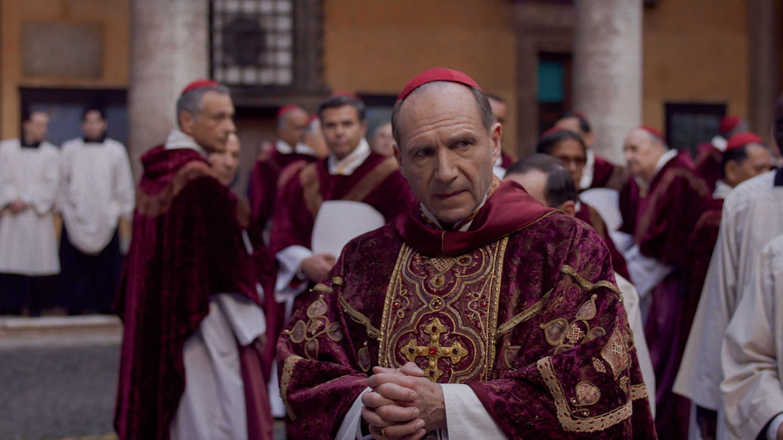 Ralph Fiennes looks worried in cardinal's robes in Conclave.