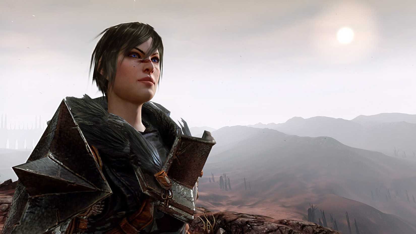 Hawke, the protagonist of Dragon Age 2, stares out across a mountainous landscape.