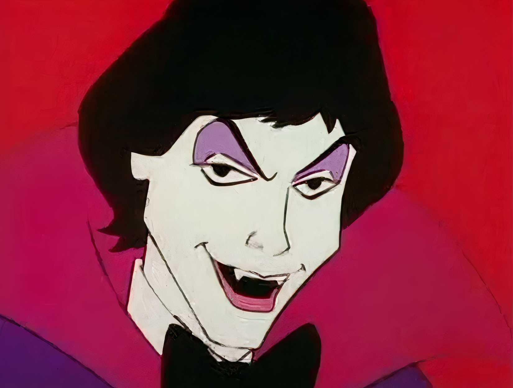 A close-up of Drak Pack's Drak, Jr., a teenage vampire with paper-white skin, black hair, a lot of purple eyeliner, a black bow tie, and a big fangy grin