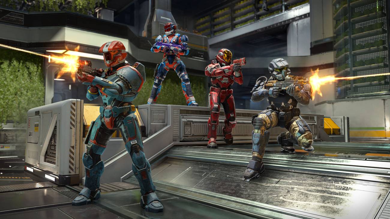 Four Spartans aim weapons on the Aquarius map in Halo Infinite