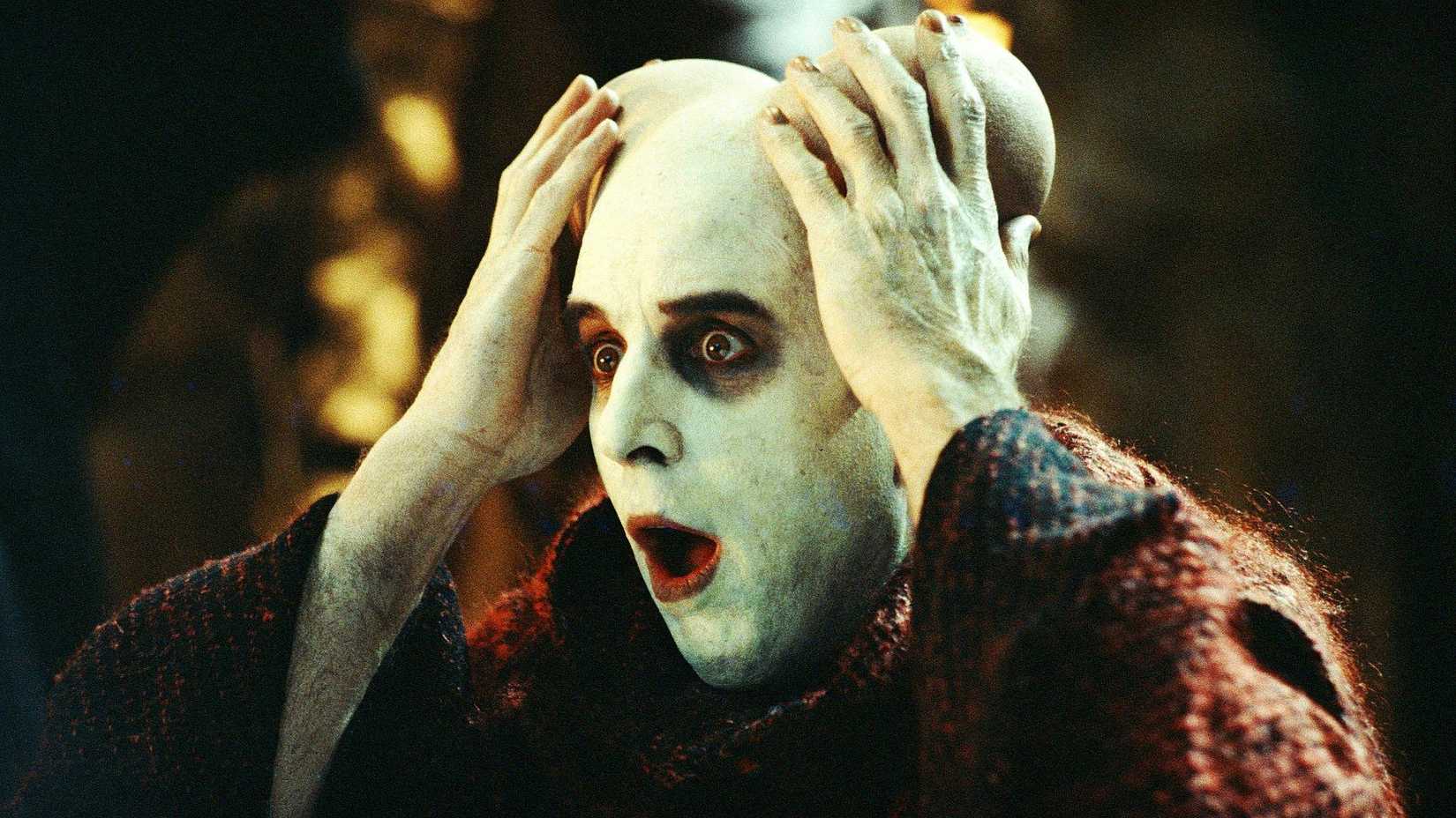 A demon in hell surprised as horns are replaced with breasts, from Little Nicky